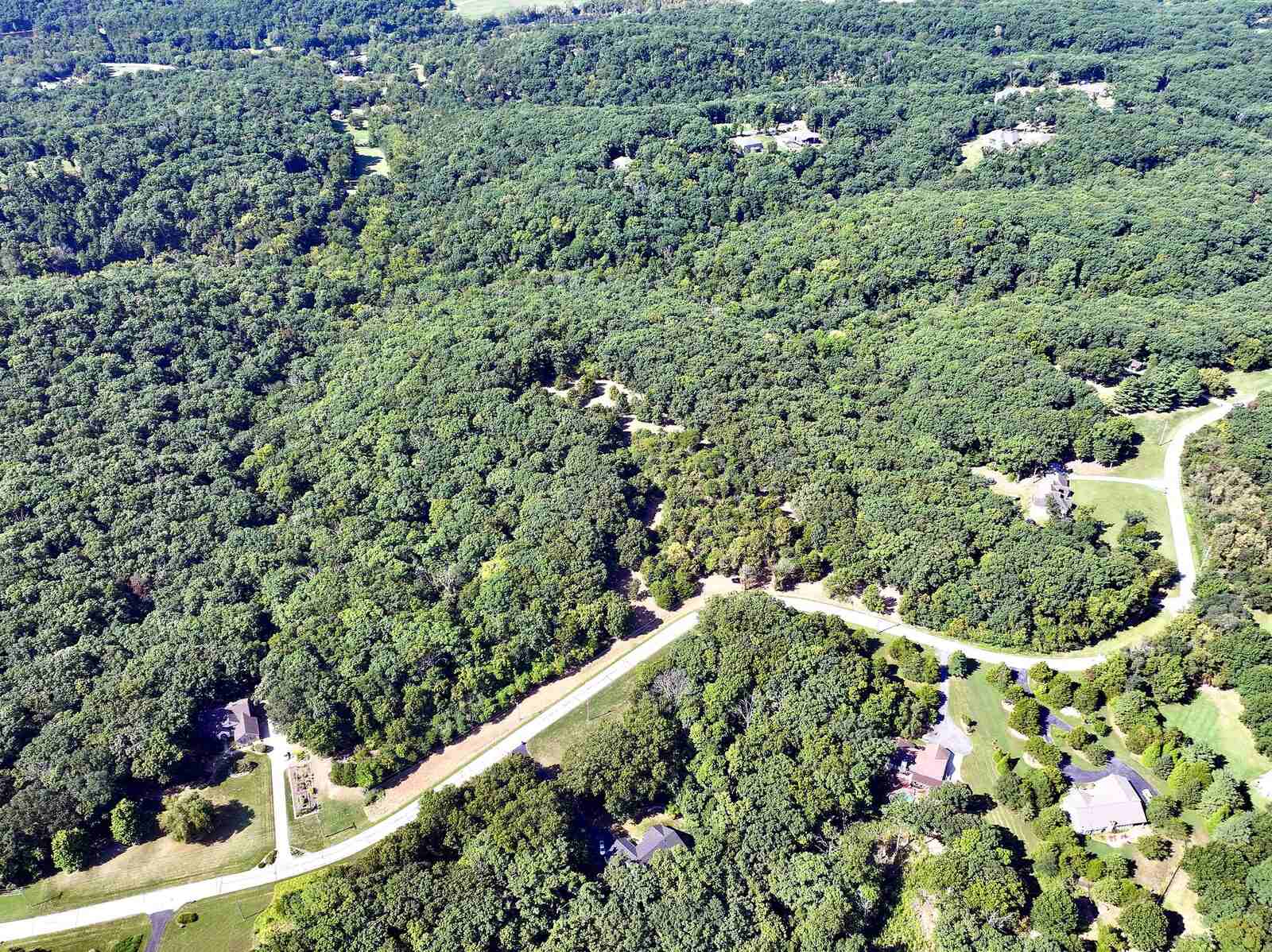 Wide aerial of Callaway Ridge showing the wooded acreage and surrounding homesites