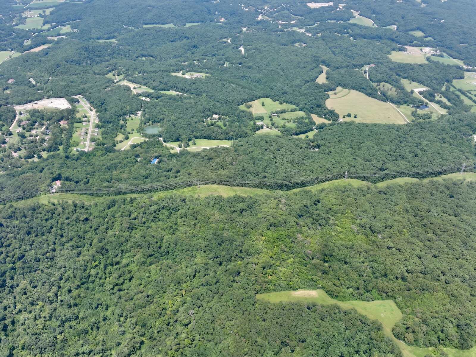 Rolling timbered terrain at Gobblers Knob with the Pacific, Missouri corridor beyond