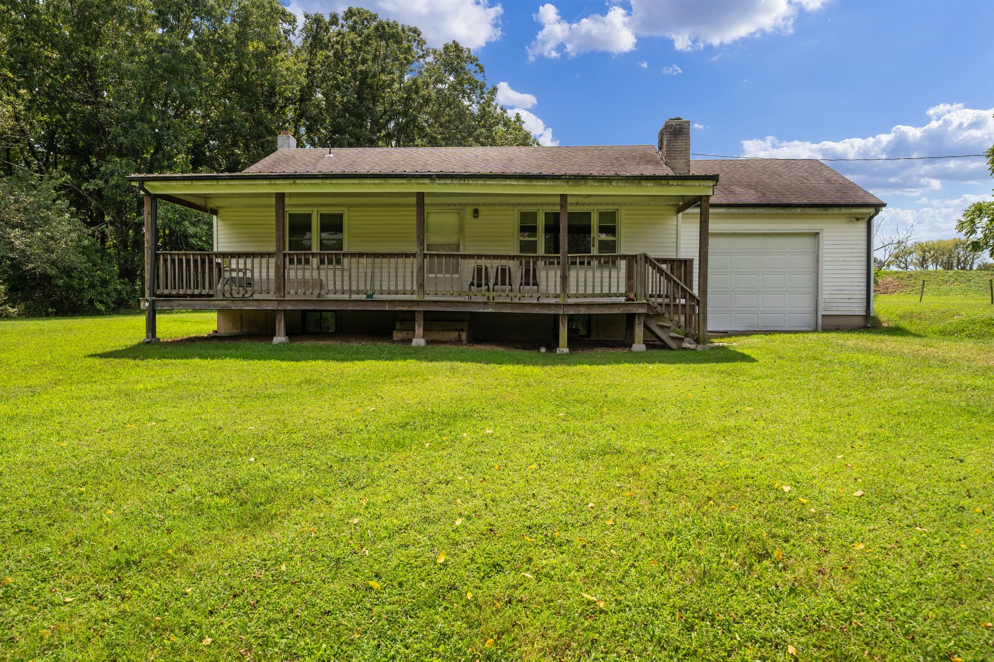 Ranch house with covered porch and attached garage