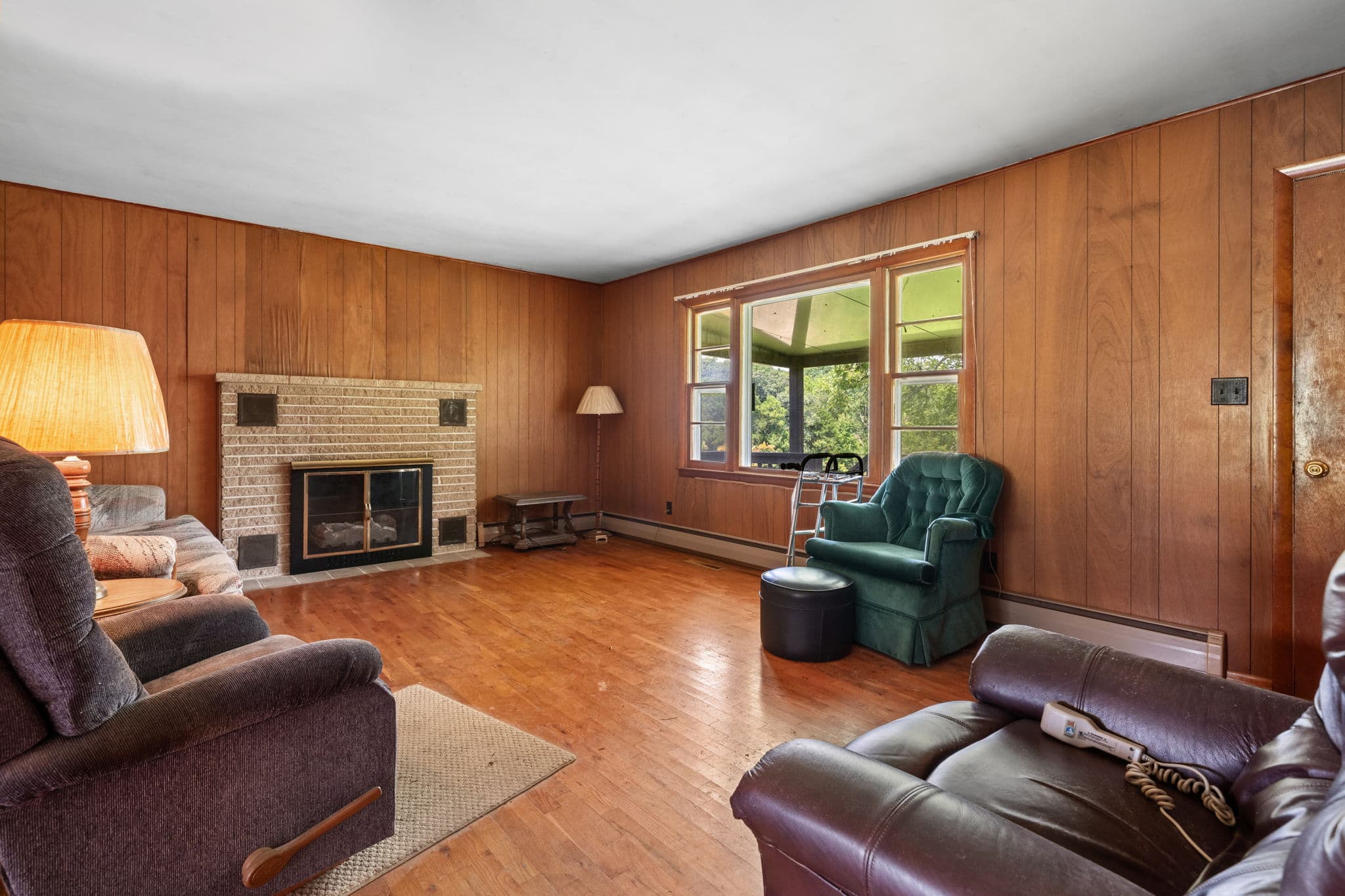 Living room with brick fireplace