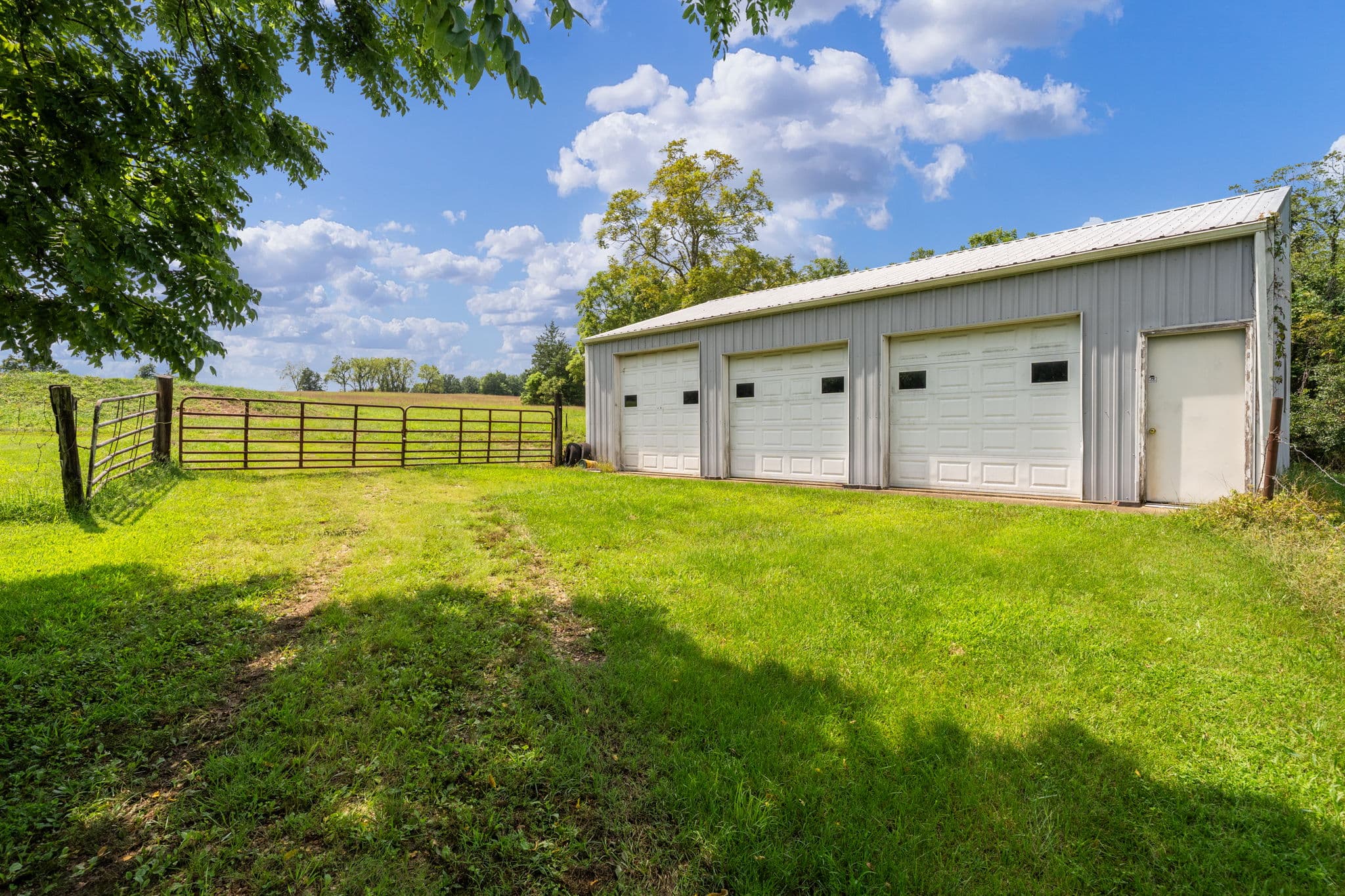 Metal shop building with fenced lot