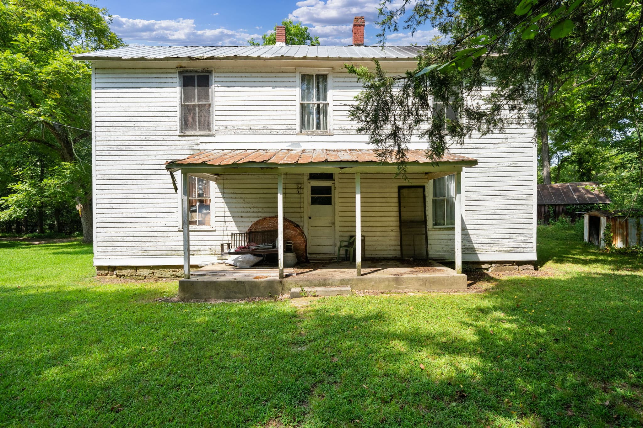 Front porch of the historic farmhouse
