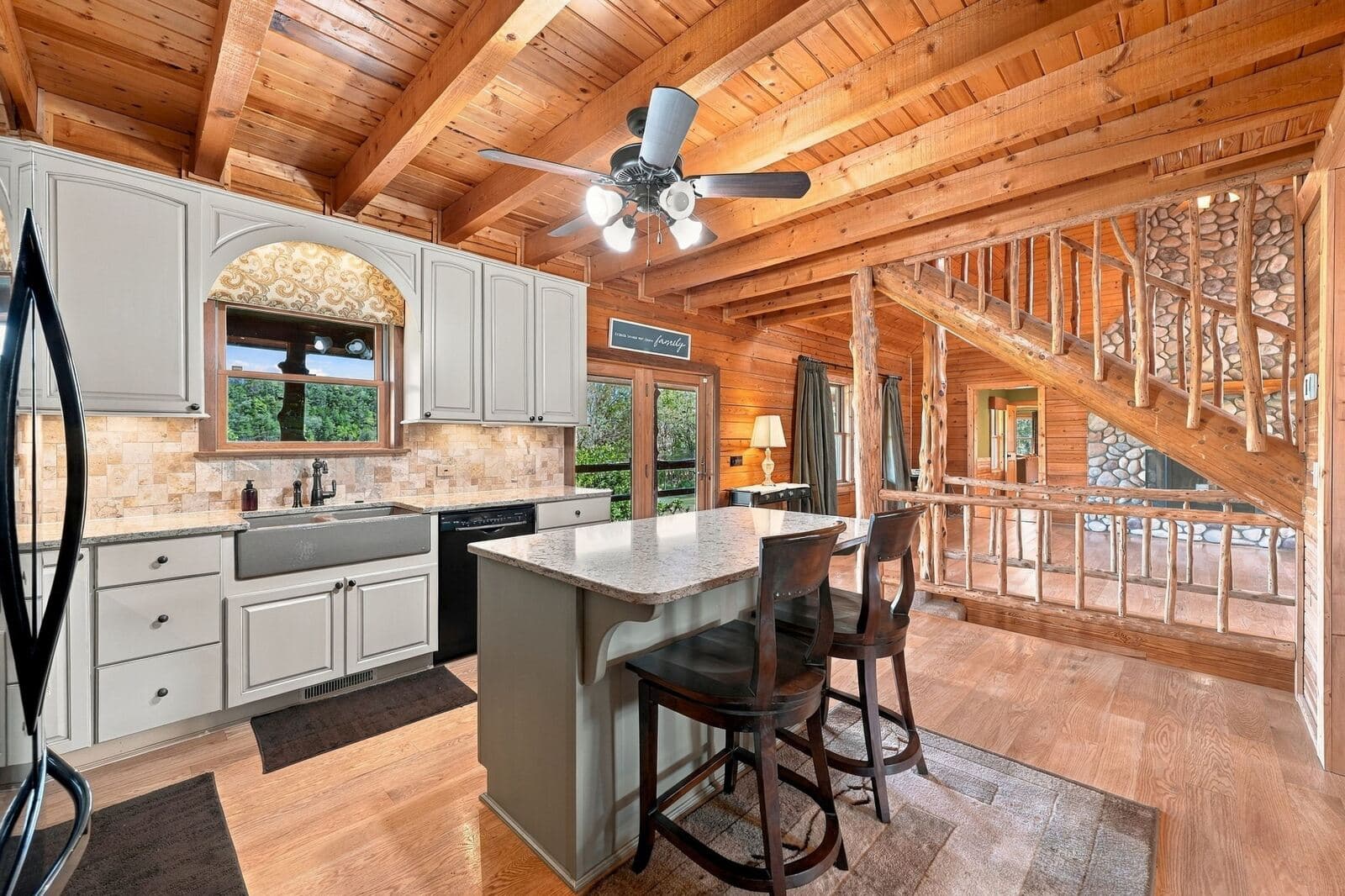 Kitchen island and breakfast bar by the staircase