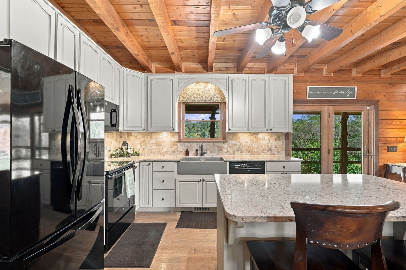Kitchen with stainless appliances and window over the sink