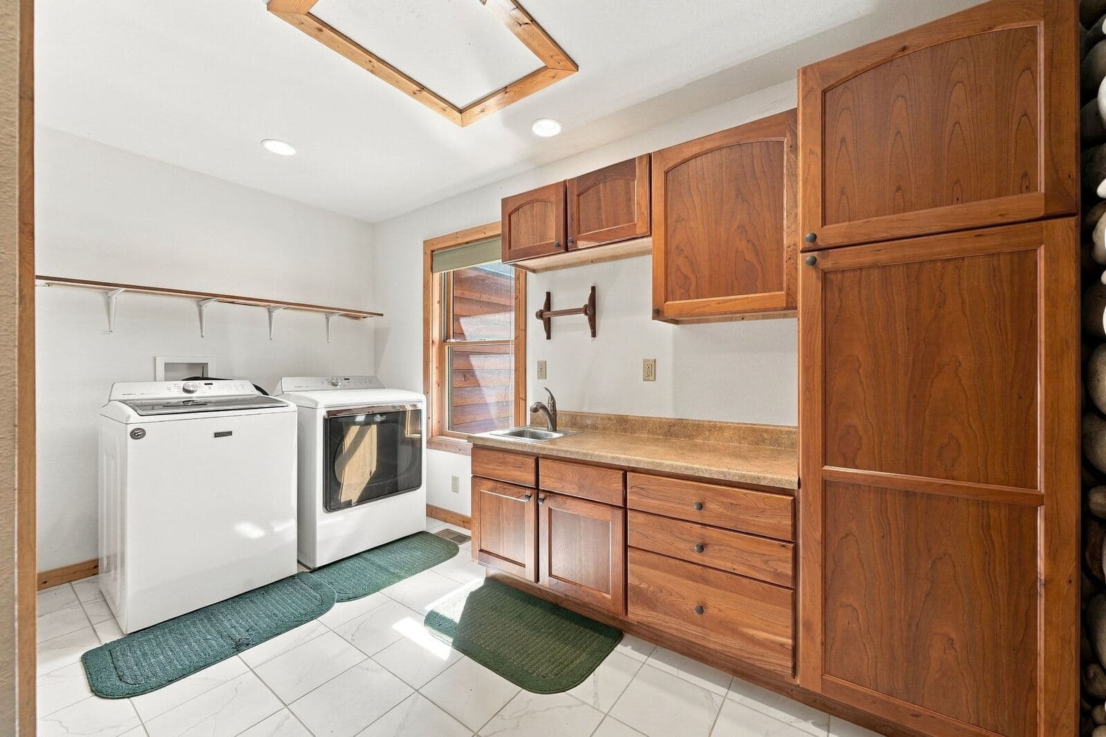 Laundry room with built-in cabinetry