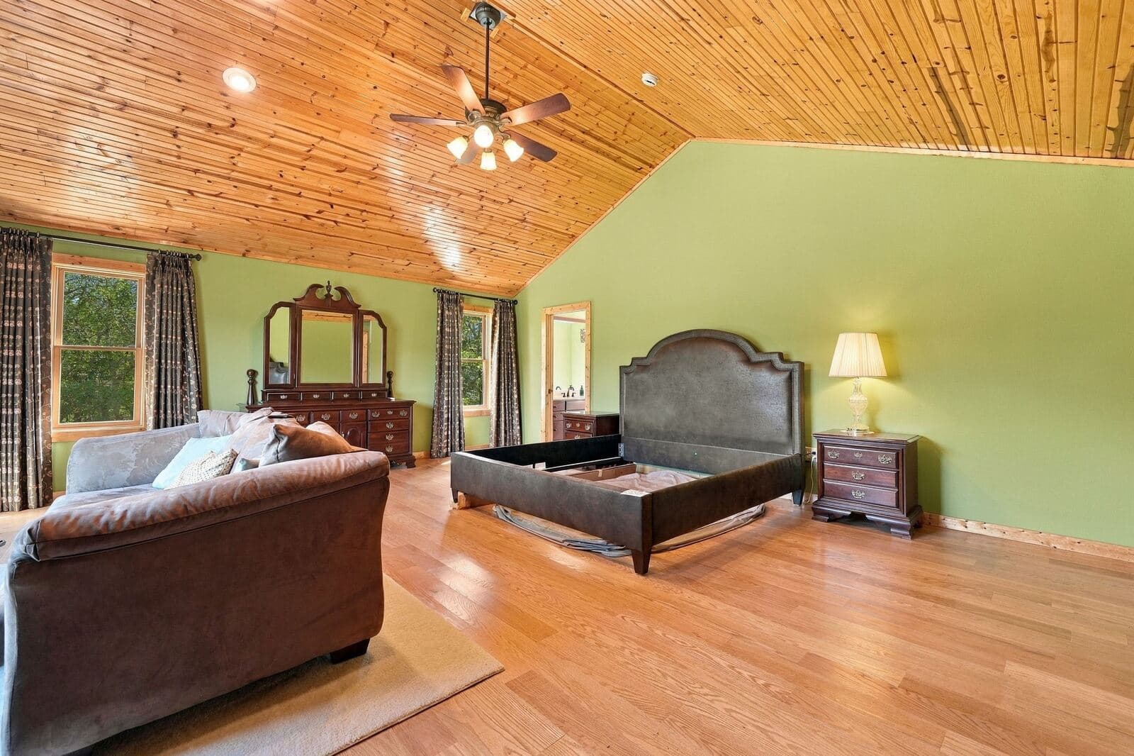 Master bedroom with vaulted pine ceiling