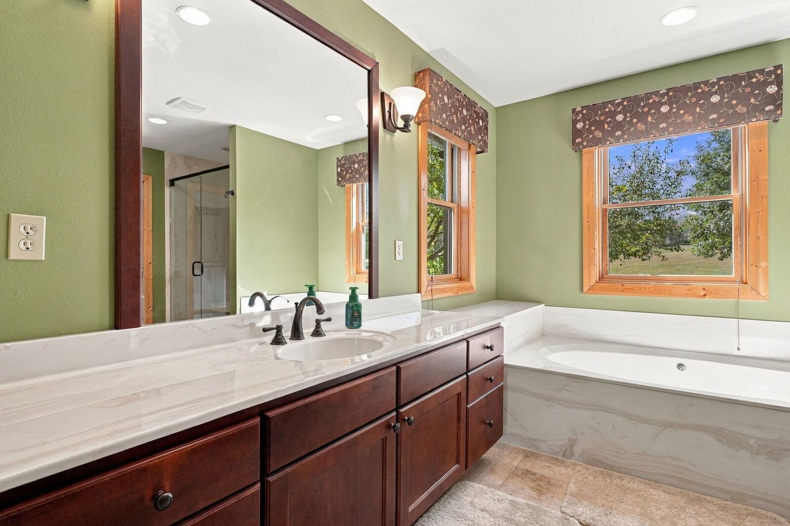 Refreshed master bath with double vanity and soaking tub