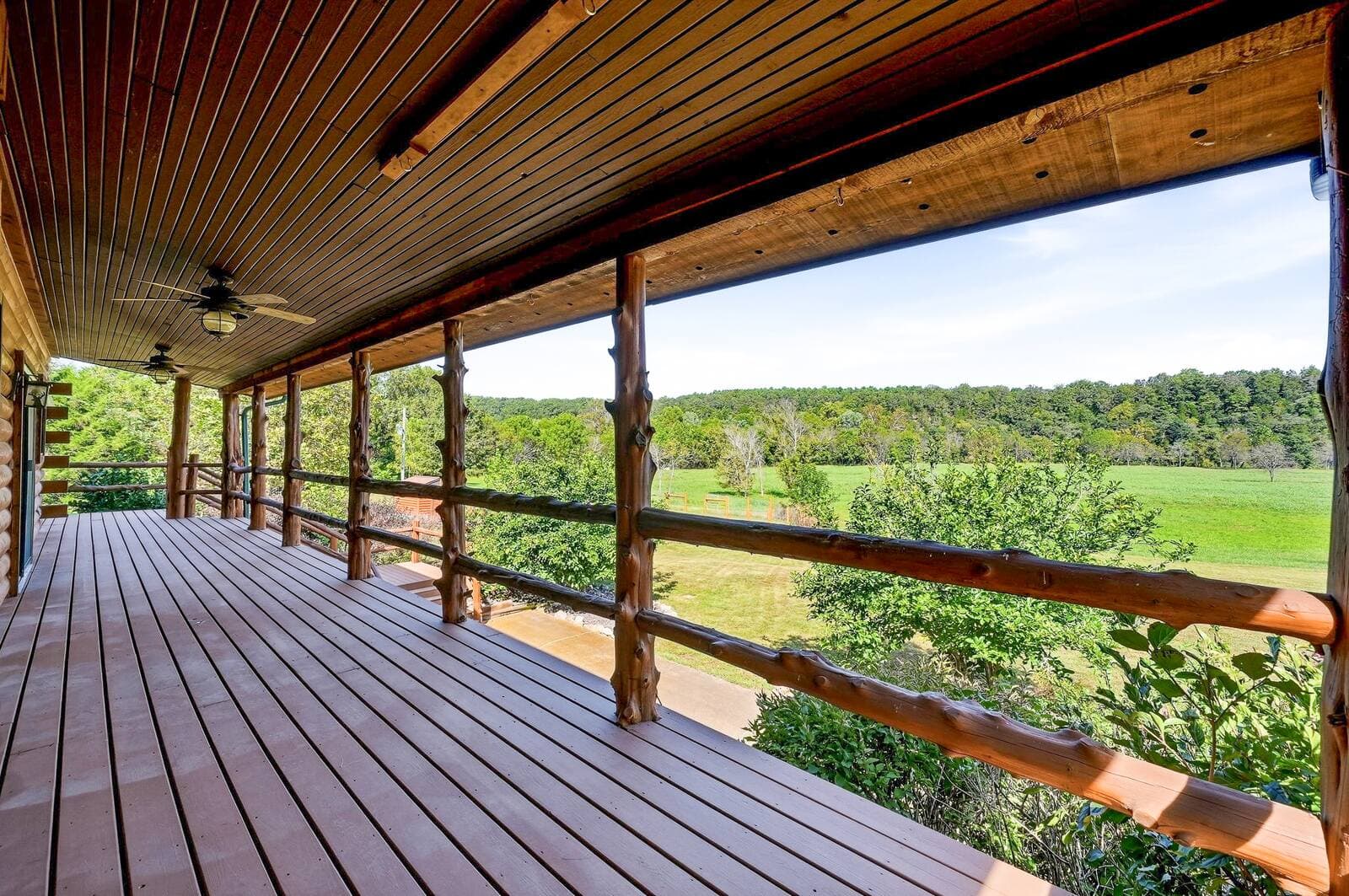 Upper covered porch overlooking the river valley
