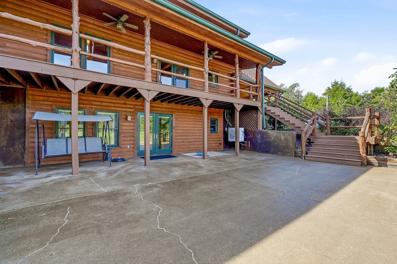 Walkout lower level and stairs to the upper porch