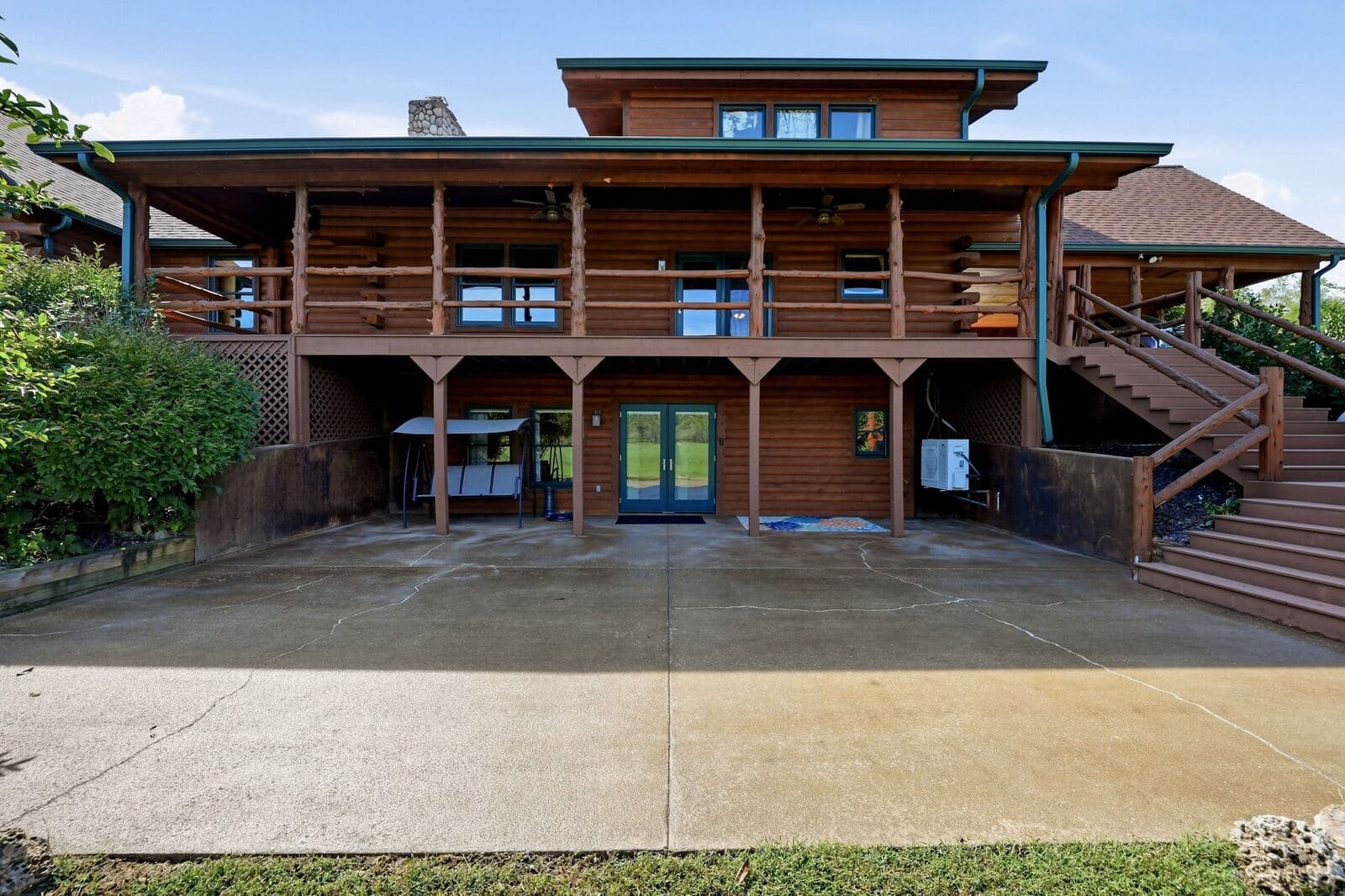 Rear of the log home with two-level covered porches