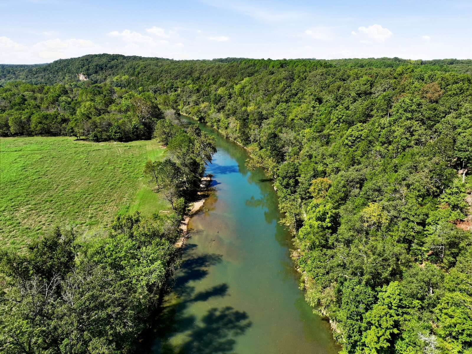 Aerial of the river corridor through the timber