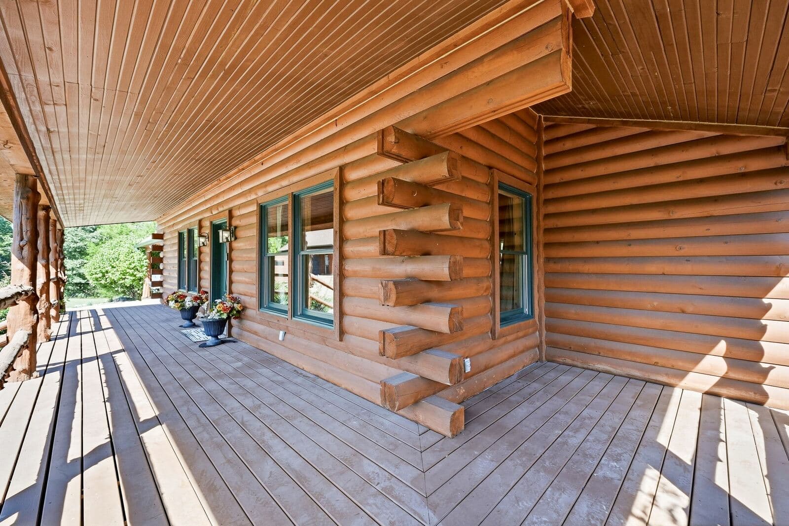 Covered front porch along the log home