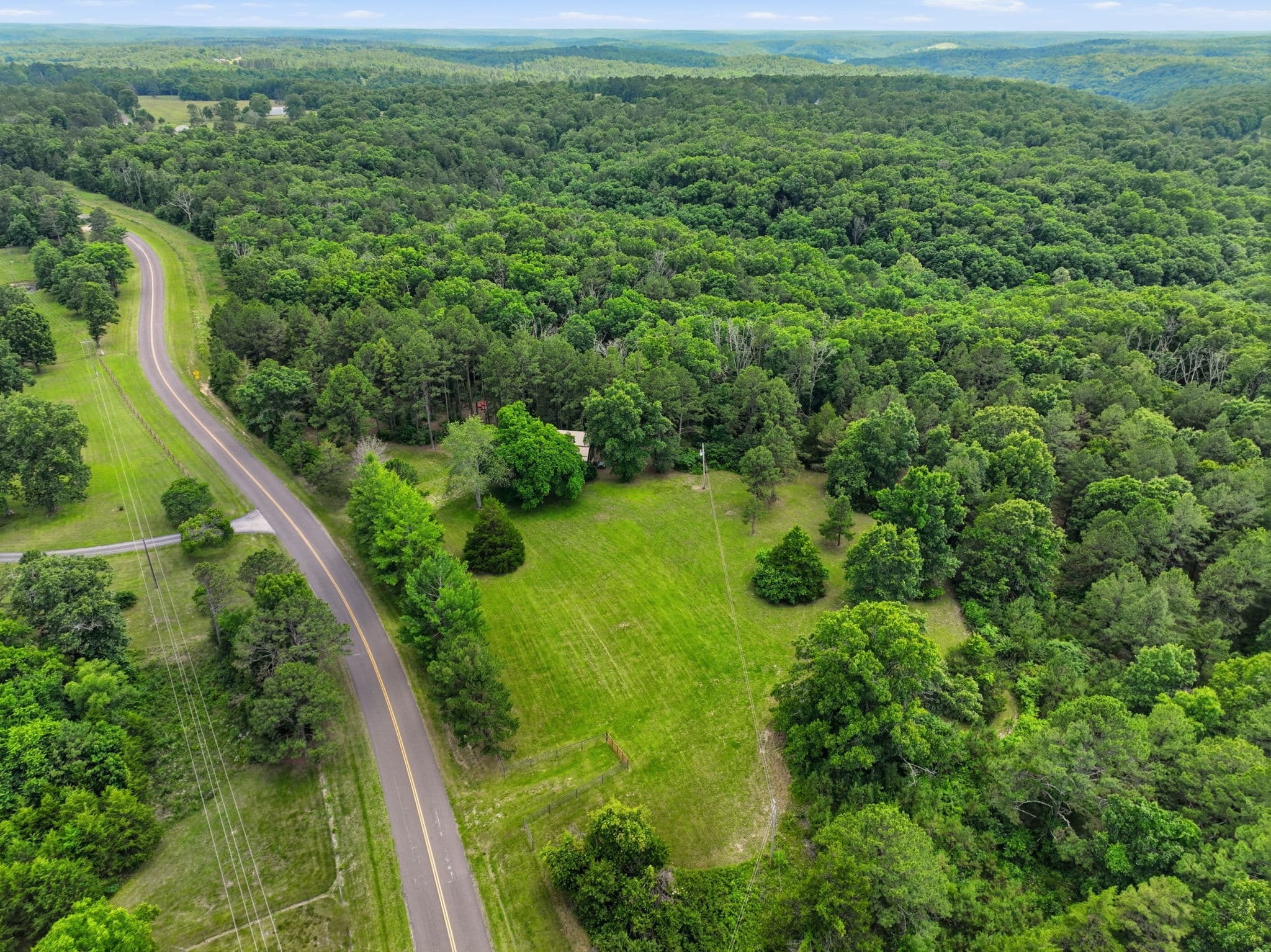 Aerial of the blacktop road through the Ozarks