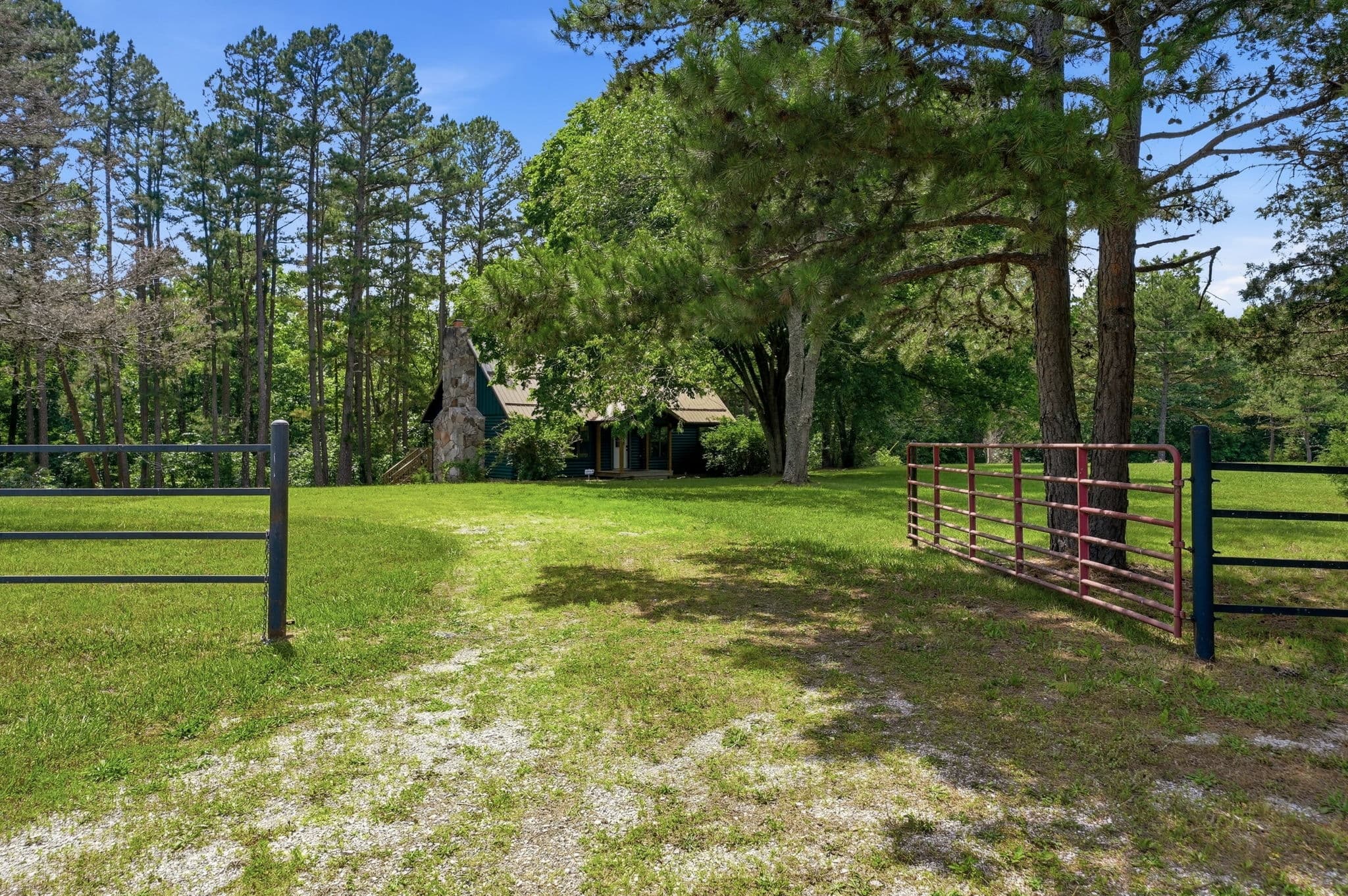 Open pasture and gated entry on the 22-acre parcel