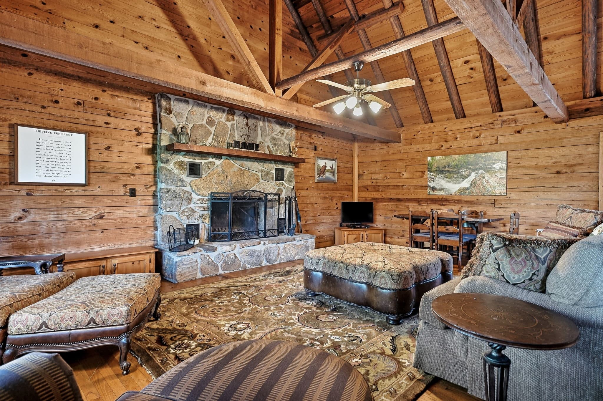 Living room with floor-to-ceiling native stone fireplace