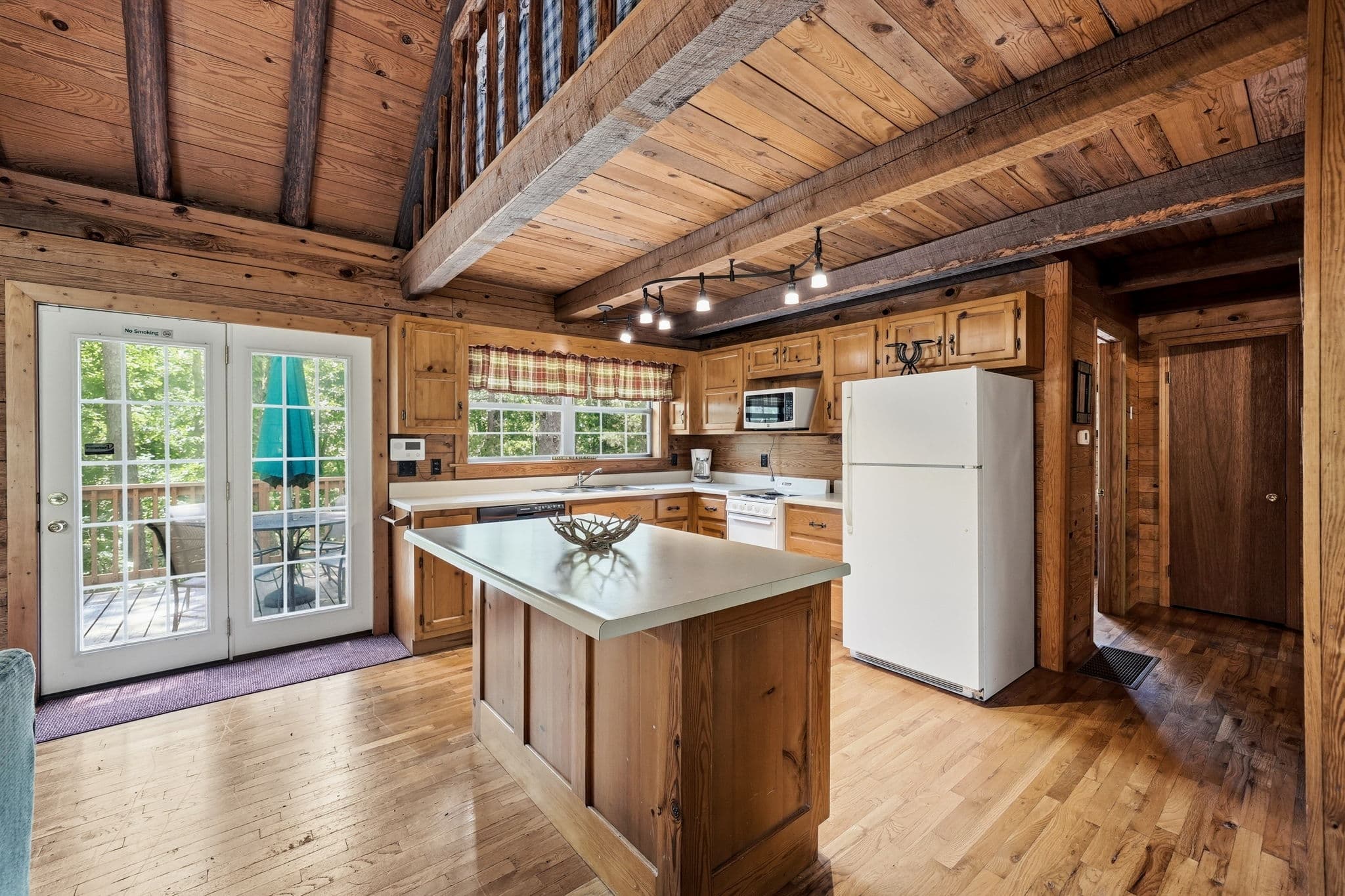 Kitchen with island and French doors to the deck