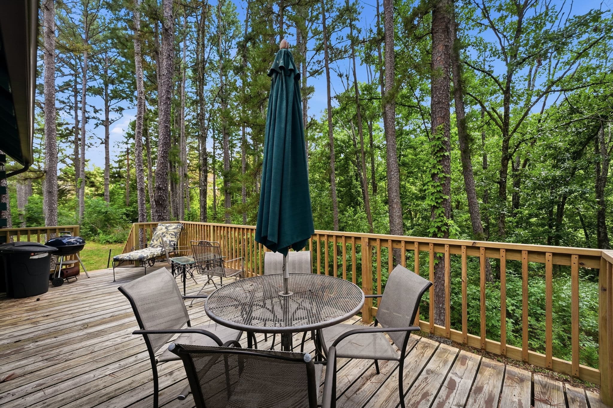 Shaded deck dining with umbrella table